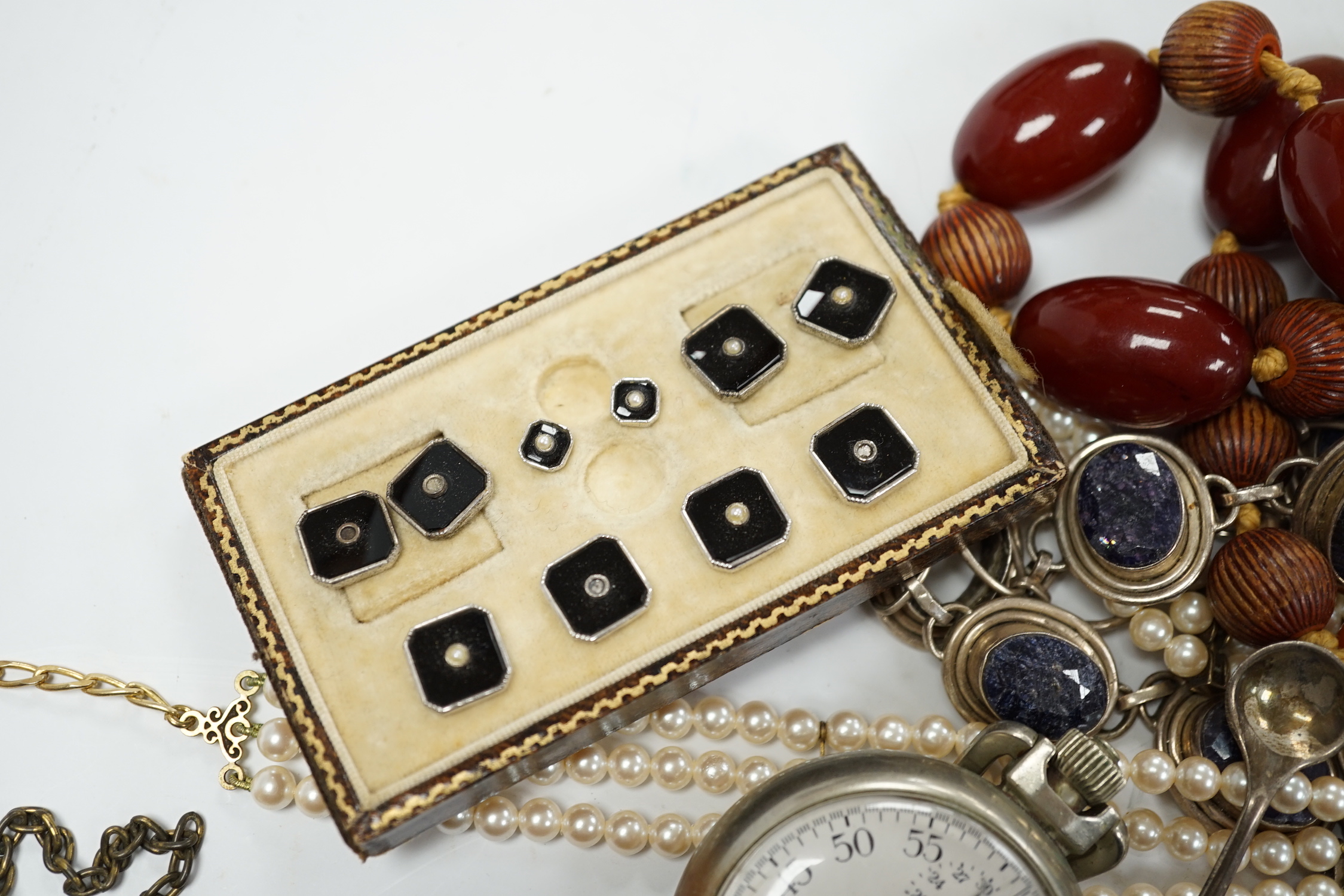 A small group of assorted costume jewellery, wrist and pocket watches and a silver envelope stamp case.